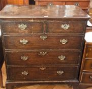 A Georgian oak chest of drawers, with moulded edge top, two short and three long graduated drawers