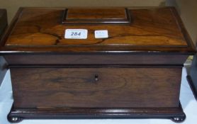 Late Regency rosewood tea caddy, sarcophagus shape, the top with thumb-mould edge and having