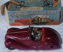 A Schuco Akustico 2002 clockwork dark red sportscar, Made in the US zone, Germany, boxed