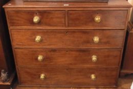 A 19th century mahogany chest of two short and three long graduated cockbeaded drawers, all with