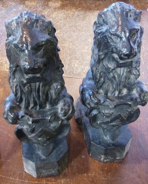 A pair nineteenth century cast iron lions rampant with shield on box base