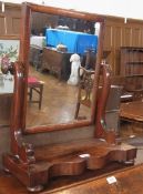 A Victorian mahogany swing frame dressing table mirror, the rectangular plate with scroll supports