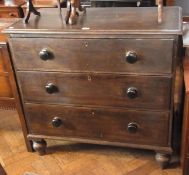Nineteenth century stained pine chest of three long graduated drawers raised on bun feet, width