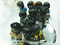 Eleven Robertson golly figures, Royal Doulton character jugs, including "Long John Silver" etc., and