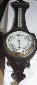 Carved oak aneroid barometer in banjo-shaped case, with thermometer, 84cm high