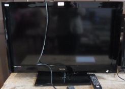 A Technika flat-screen television together with remote control