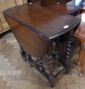 Twentieth century oak oval top gateleg table on turned spiral supports united by stretchers, width