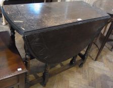 Twentieth century stained oak oval gateleg table with lunette carved border, raised on turned