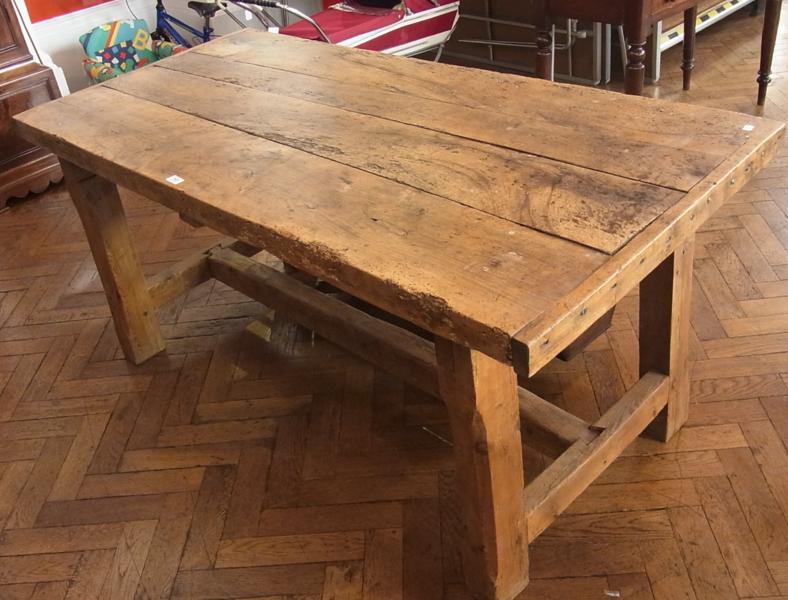 Nineteenth century sycamore and pine rectangular table with four  plank top and clisset ends on