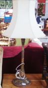 Stained wood and carved table lamp, painted with white roses, and white shade