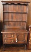 20th century Jacobean style oak dresser with open two shelf platerack, two moulded front short