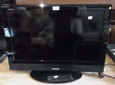 A Toshiba Regza flat-screen television together with remote control