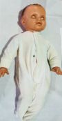 A composition baby doll, large, with sleepy eyes, moulded hair, open mouth, 57cms approx.