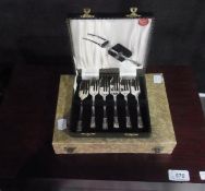 A six piece silverplate canteen of cutlery, to include:- knives, forks, tablespoons, dessert spoons,