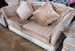 Modern beige upholstered armchair, on castors