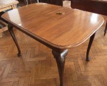 Georgian style mahogany dining table with moulded edge, the plain frieze raised on cabriole legs