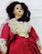 Girl doll, impressed marks LM84 STOW 70, the head is loose from the body, she is wearing a red dress