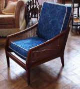 Stained wood bergere style chair, with canework back and sides
