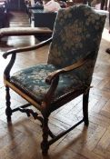 Stained wood elbow chair, with highback and canework seat, on turned front supports