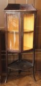 An Edwardian mahogany bowfront glazed corner display cabinet, with satinwood banding, the pair doors