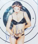 Signed photograph of Madonna, certificate on reverse, framed and glazed, 24 x 20cm