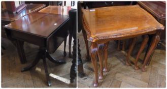 Mahogany reproduction drop flap coffee table with frieze drawer raised on pedestal support with four