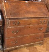 Georgian oak bureau, with fitted interior, three long graduated drawers on bracket feet, width