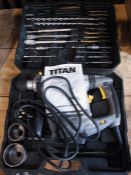 A Titan electric rotary hammer 1500 watts together with a commercial/industrial attachment, cased