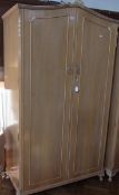 Twentieth century walnut Cabinet Works, London double wardrobe, with plastic foliate details, double