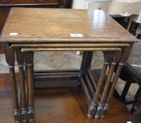 Nest of three oak occasional tables with rectangular tops on elegant turned legs, width 46cms