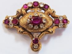 Victorian gold coloured metal. ruby and diamond brooch, shaped oval centre having oval ruby