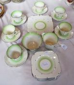 A Bell china part tea service, Art Deco style, silver spots and rim with pale green decorations on a