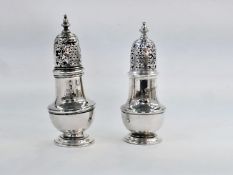 Pair George III silver pepperettes, each of shouldered baluster shape with high domed pierced cover,