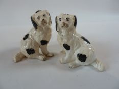 A pair Staffordshire black and white spaniels