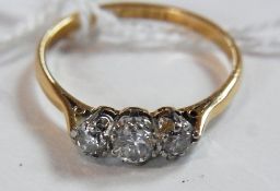 18ct gold three-stone diamond ring, the stones claw set