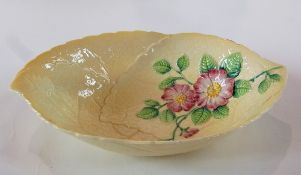 A Carlton Ware yellow leaf dish, decorated with pink dog roses and green leaves