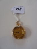 Lady's 18K gold fob watch with floral and scroll engraved case and face, button winding