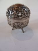 A Tibetan-Burmese silver circular bowl and cover with Hindu goddess decoration raised on paw feet