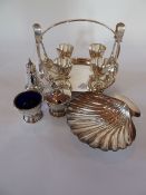 A silver plated eggcup stand for four eggs, with the eggcups but spoons missing, a scallopshell