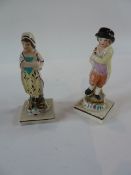 Pair 19th century Staffordshire pottery figures, man and lady carrying hen and cockerel