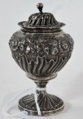 William IV pepper pot, with fretwork cover and floral repousse decoration raised on a circular foot,