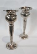 Pair George V silver flower vases, with wavy edged rim, globular bowl raised on a tapering