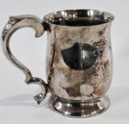 Elizabeth II silver half-pint mug, with foliate scroll handle raised on circular foot, Sheffield