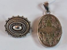 Silver-coloured locket, oval, decorated with flowers and initials engraved and a silver-coloured