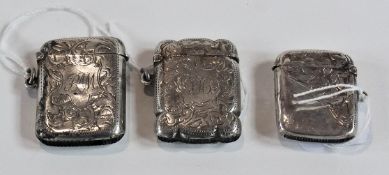 Three early 20th century silver vesta cases, with foliate engraving
