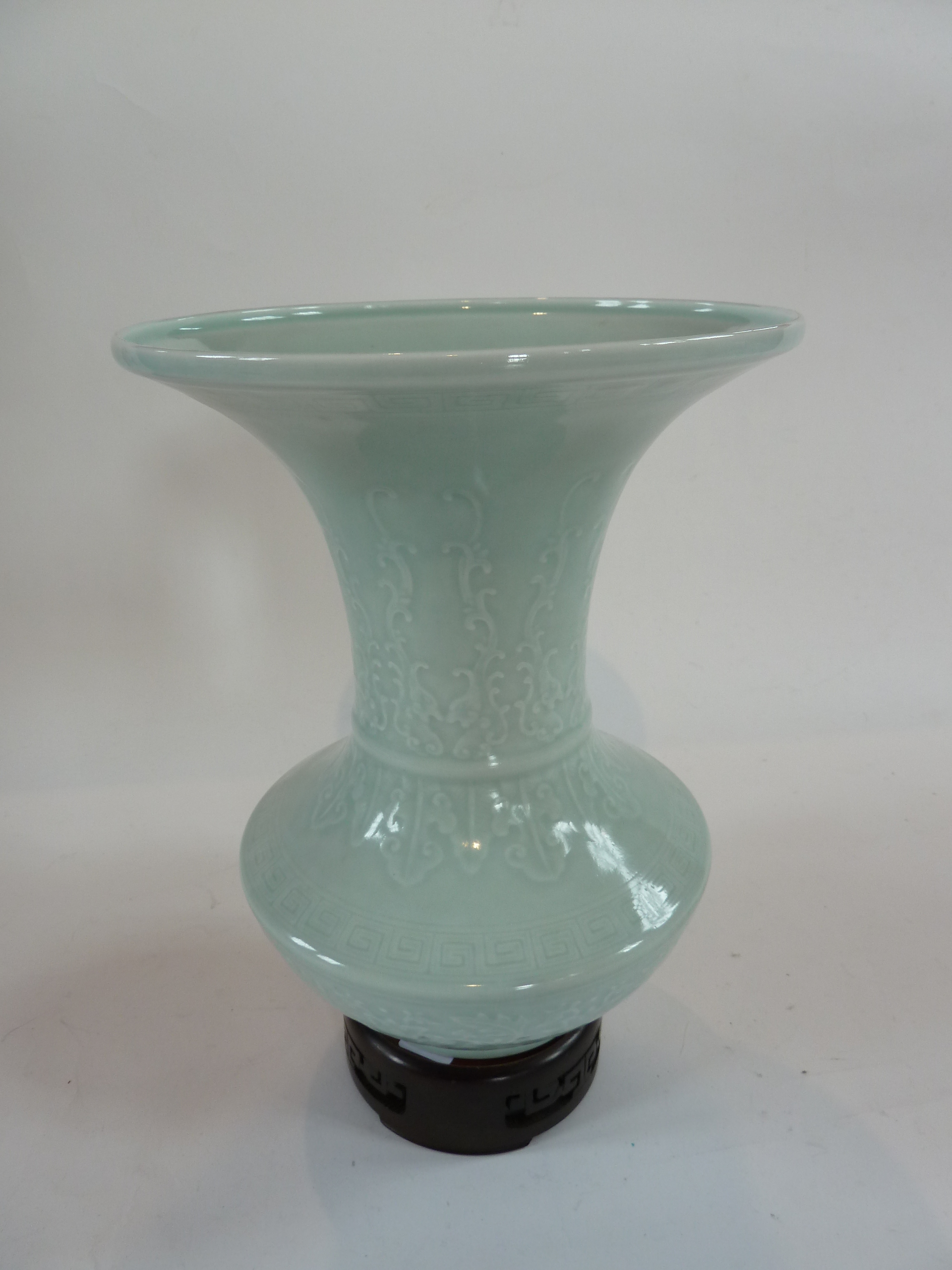 Chinese Celadon porcelain vase, Chien Lung mark, of angular baluster shape with broad flared rim and