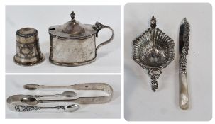 Two silver sugar nips, oval lidded mustard pot, silver tot cup, a silver bladed butter knife with