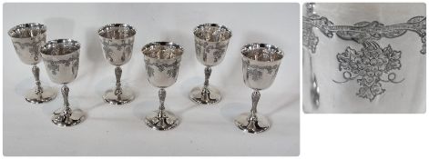 Set of six modern silver wine goblets, with flared rim, vine leaf decoration, with stem base to a