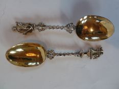 Two foreign silver partial gilt spoons, one inscribed dated 1762, with pierced entwined handles,