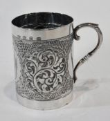 A Victorian silver christening mug, with foliate scrollwork repousse decoration, scroll handle,